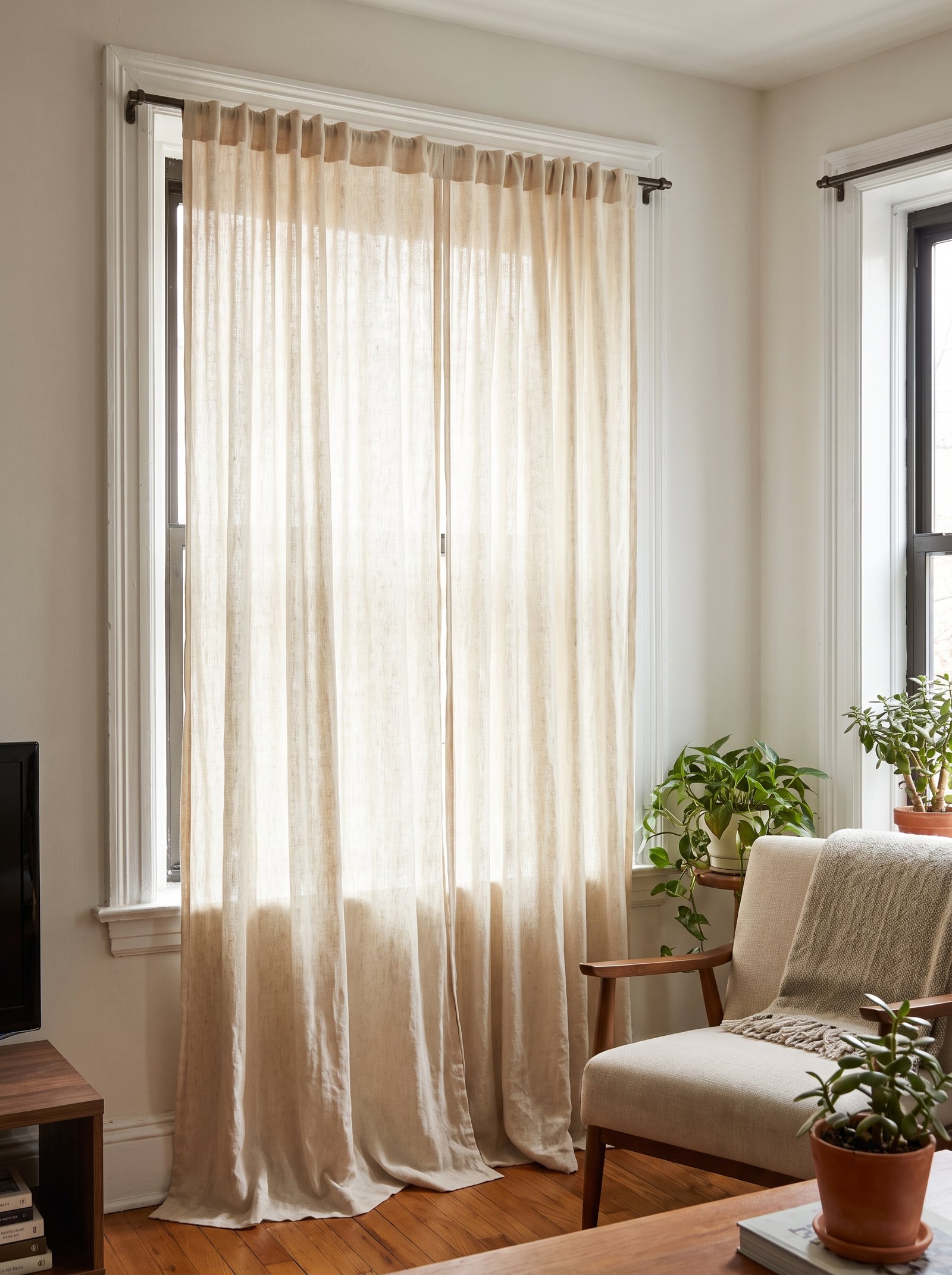 Hang tension-rod curtains from ceiling to floor